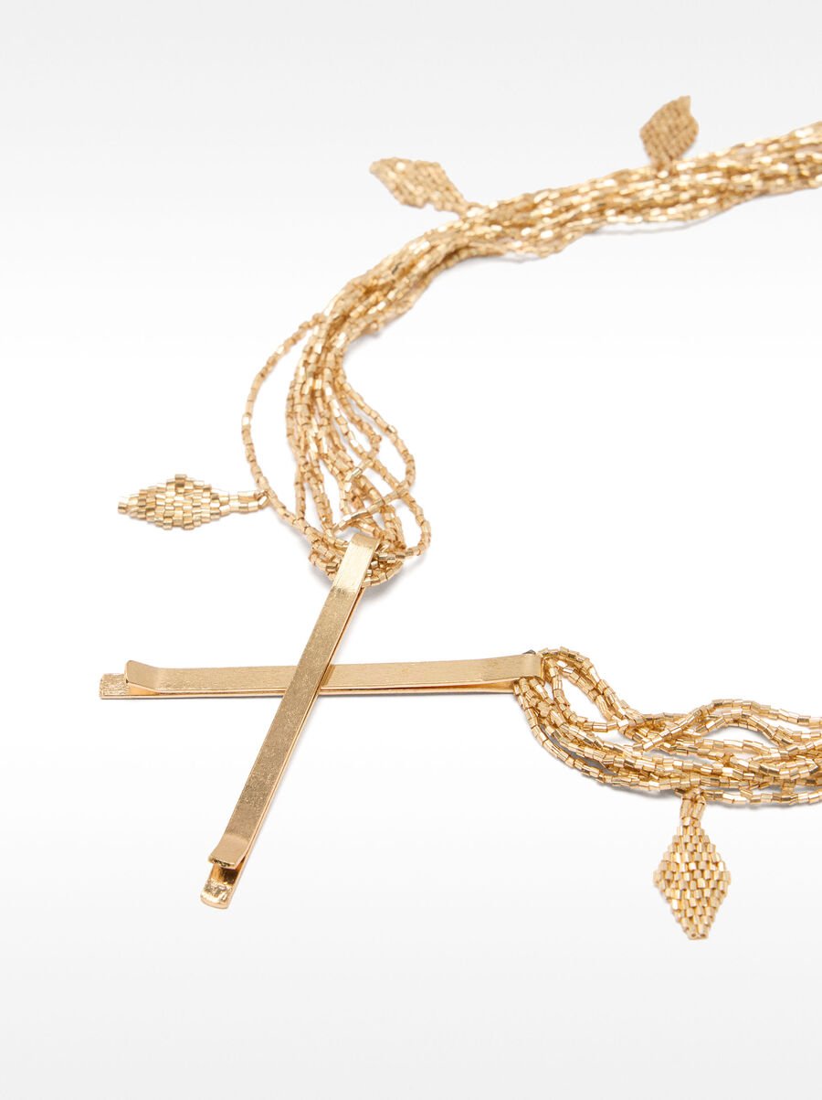 Set of hairpins with gold embellishment