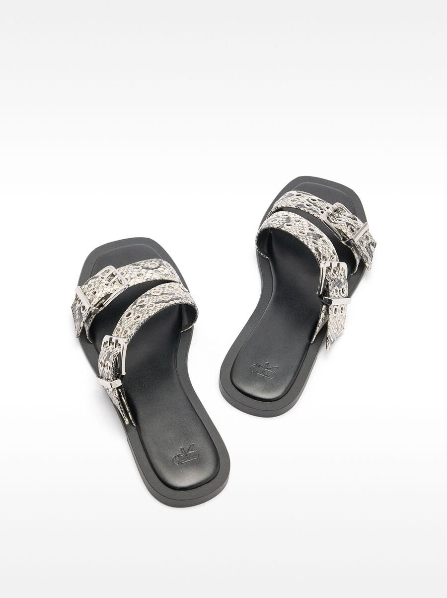 Flat sandals with buckles and studs
