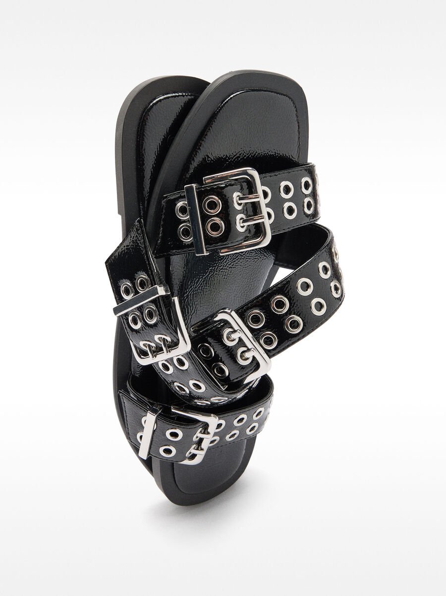 Flat sandals with buckles and studs