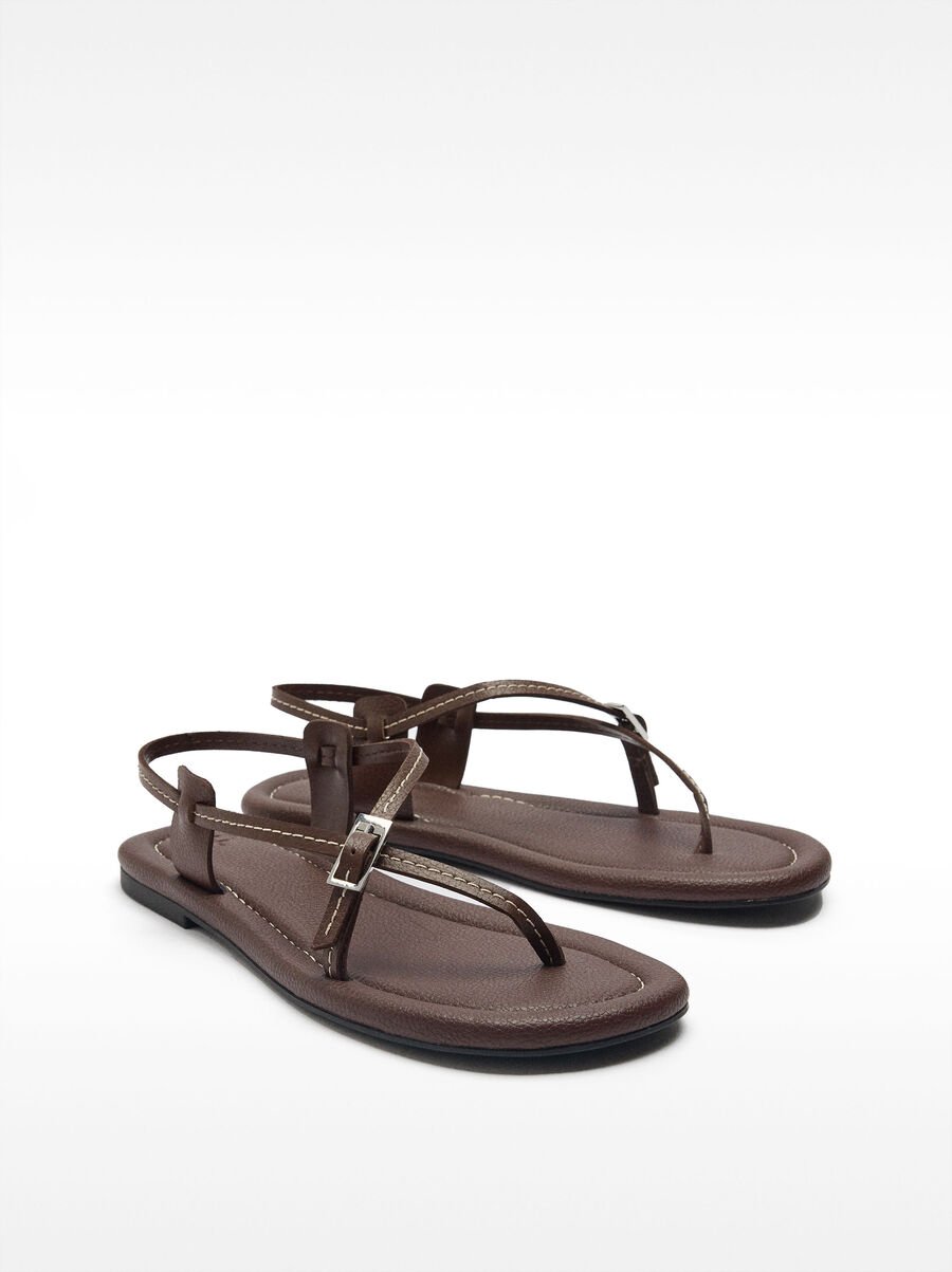 Flat leather sandals with thin straps